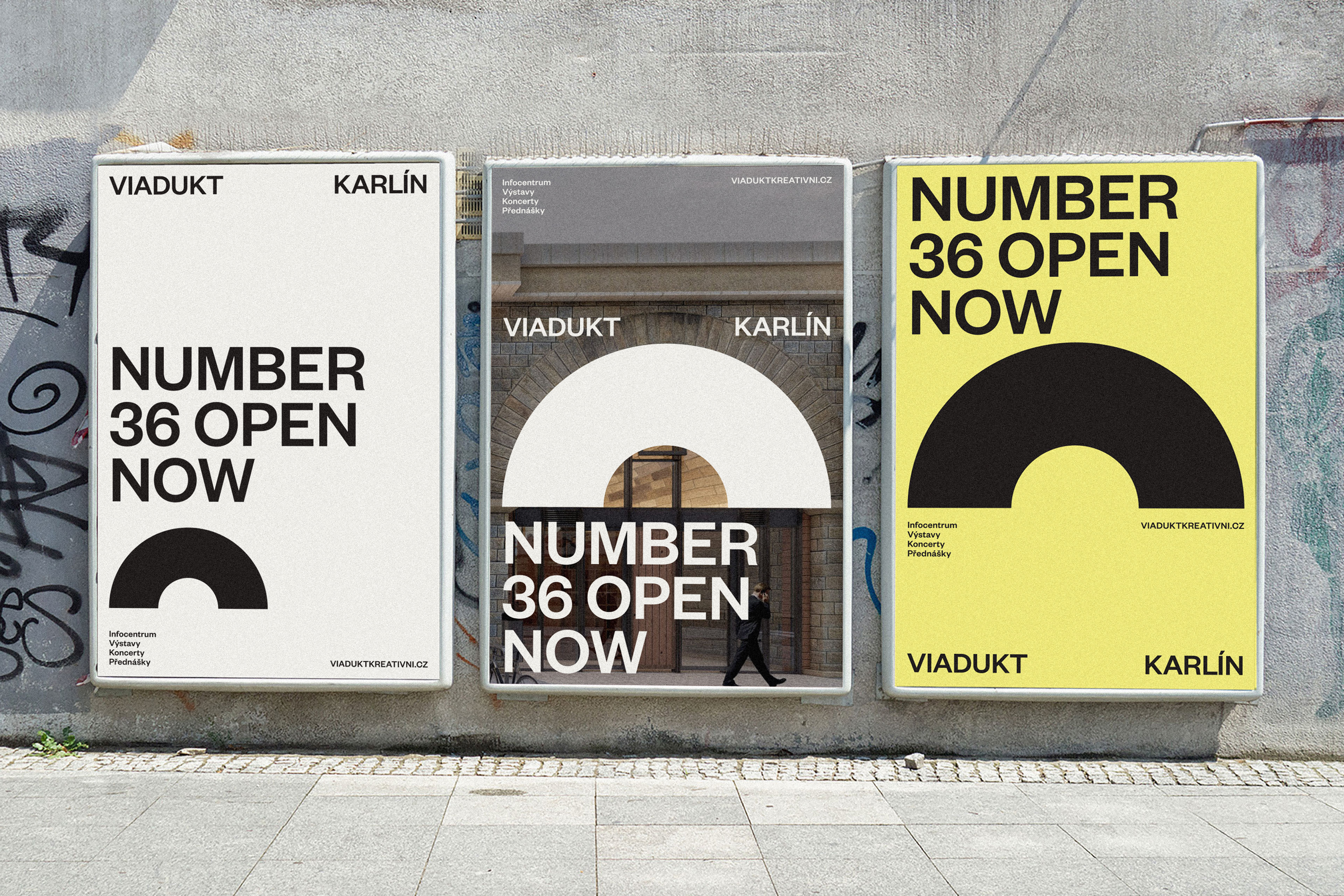 A number of posters on the side of a building.